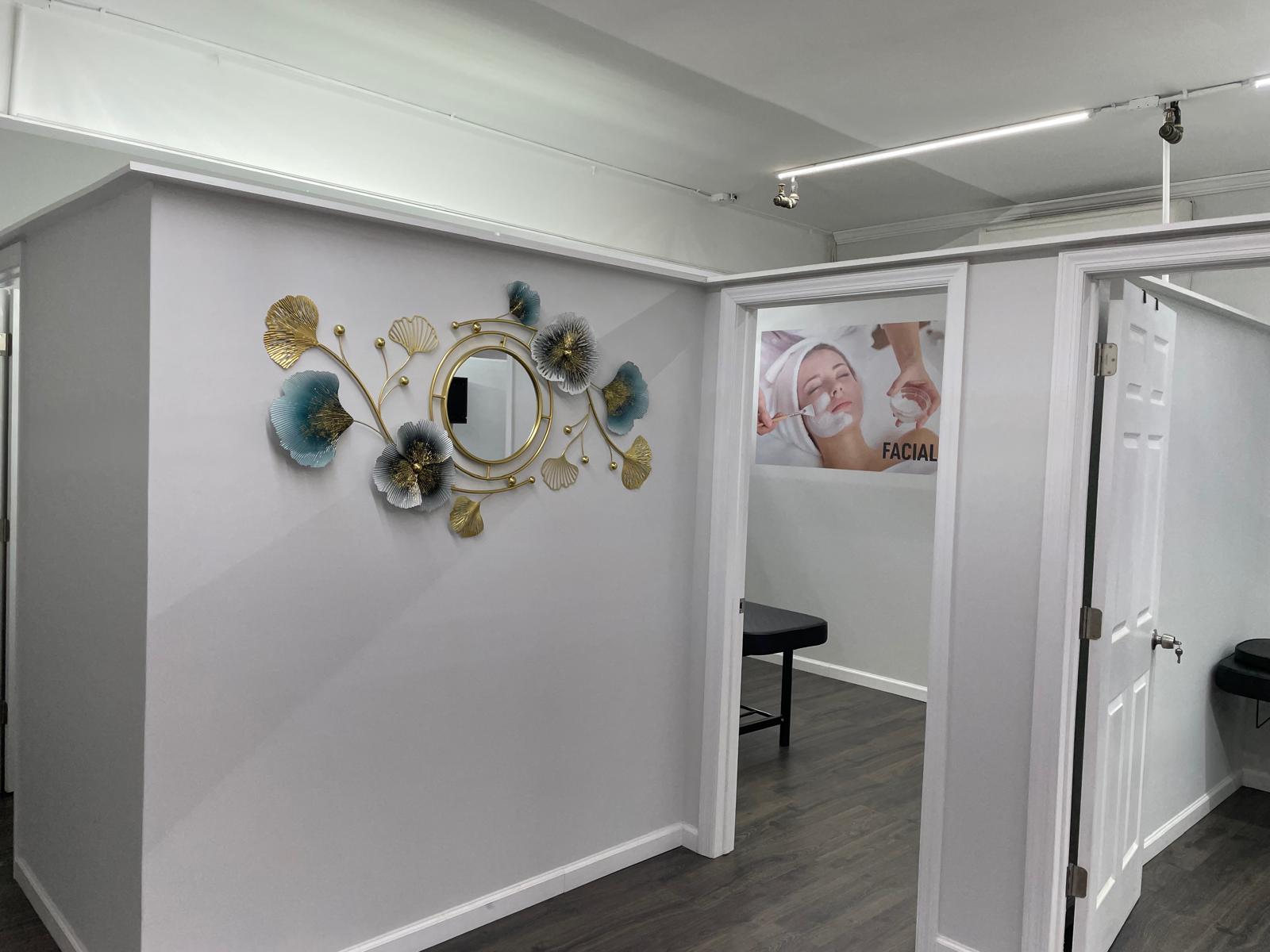 Elegant hallway with gold and teal floral wall art framing the doorway